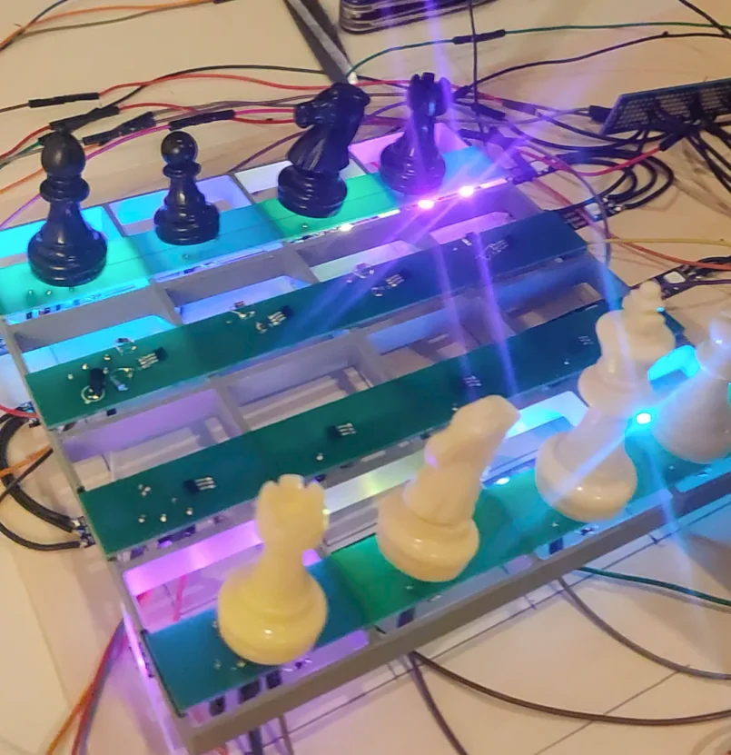 V1 4x4 miniature chess board prototype with custom green PCB strips and glowing LEDs